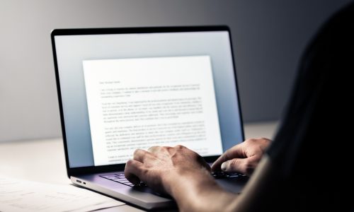 Writing blog or content. Writer with laptop computer. Typing letter, article, book, college essay, text document or cv. Business news report. Journalist or editor working. Student application.