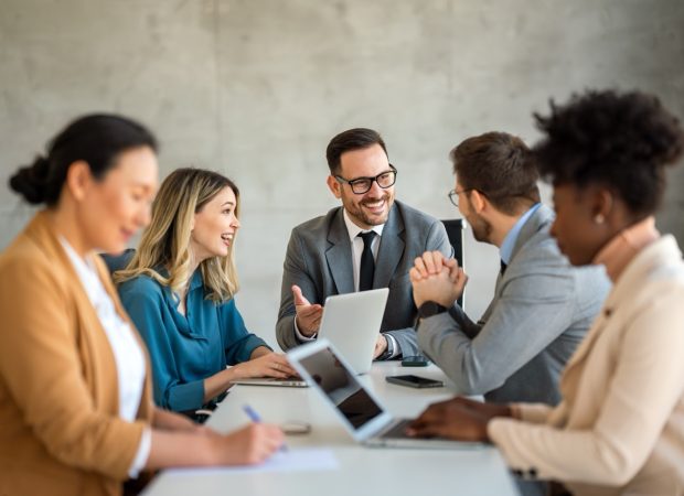 How We Work: Our 4D Approach Successful business professionals presenting analytical report, working together in corporate office